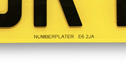 Close-up of the supplier marking printed on the plate: NUMBERPLATER E6 2JA